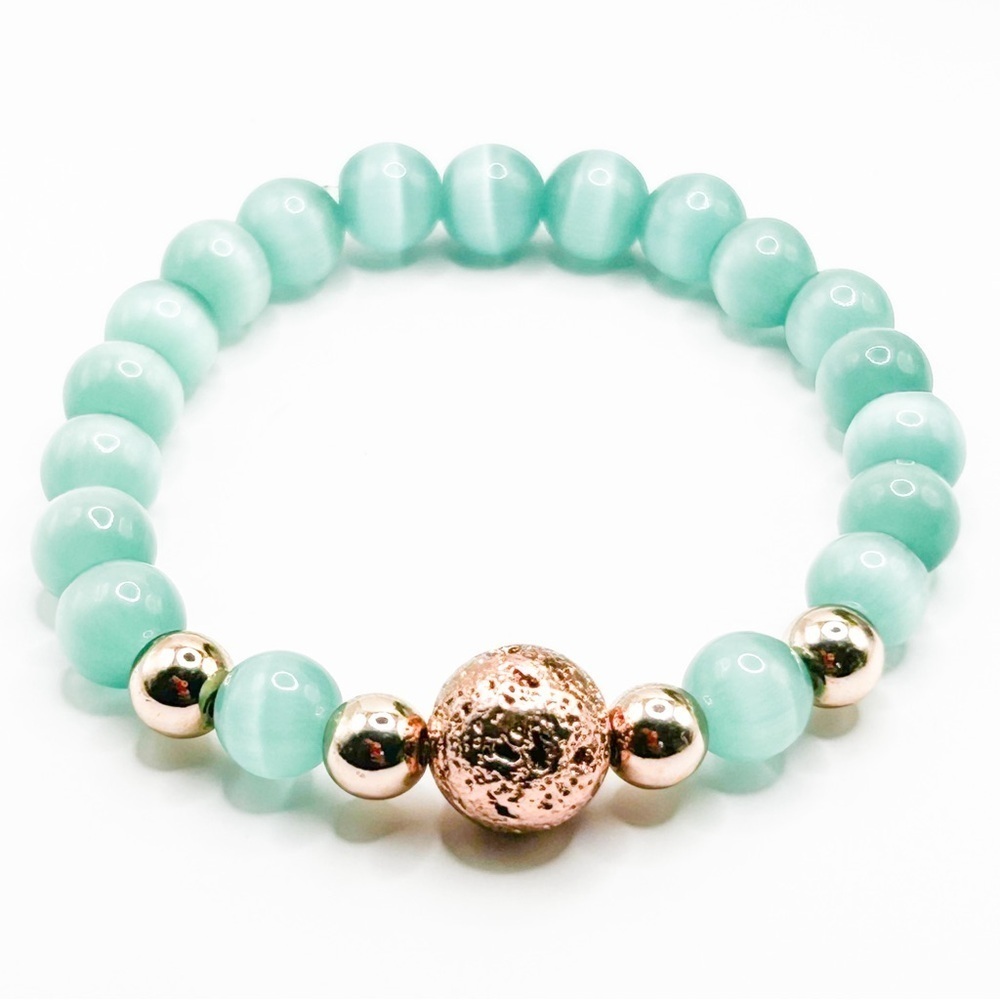NWOT Genuine green cat eye stretch bracelet with rose gold lava rock 6”